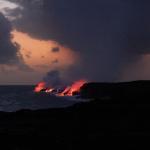 View of lava flowing into the ocean