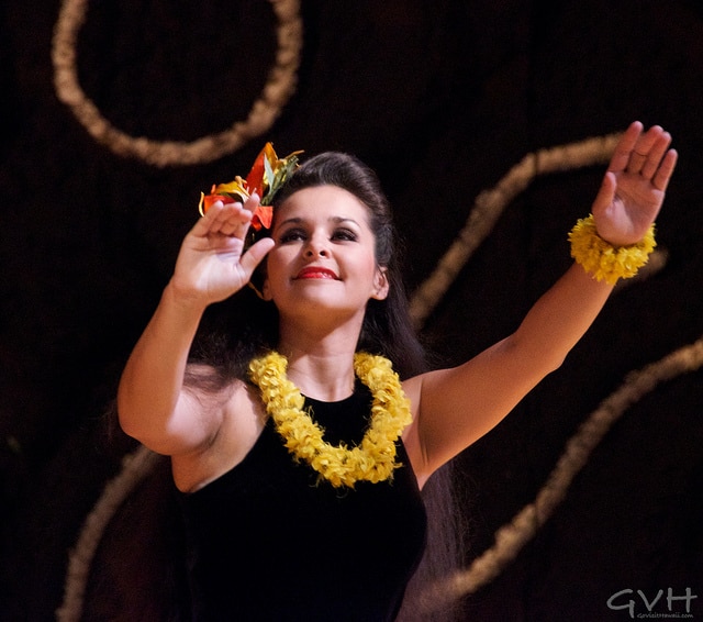 A graceful hula dancer at a luau